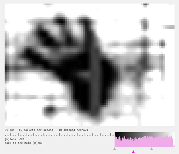 The tracking software shows the image of a hand.